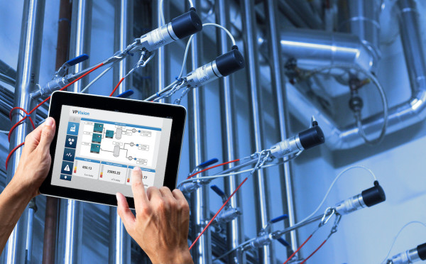 Technician using ultrasonic air leak detector on compressed air system