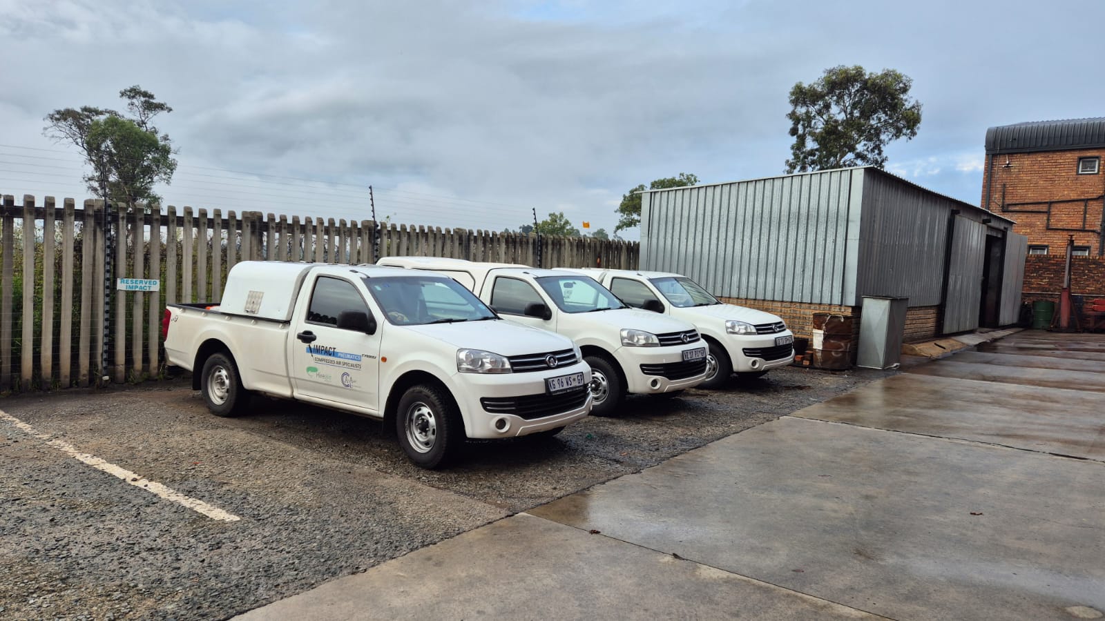 On-site service fleet Impact Pneumatics branded service vehicles lined up, used for on-site compressor servicing across Gauteng